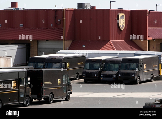 delivery-trucks-and-trailers-at-at-ups-united-parcel-service-facility-in-horsham-pennsylvania-on-april-22-2018-MFB4R1.jpg